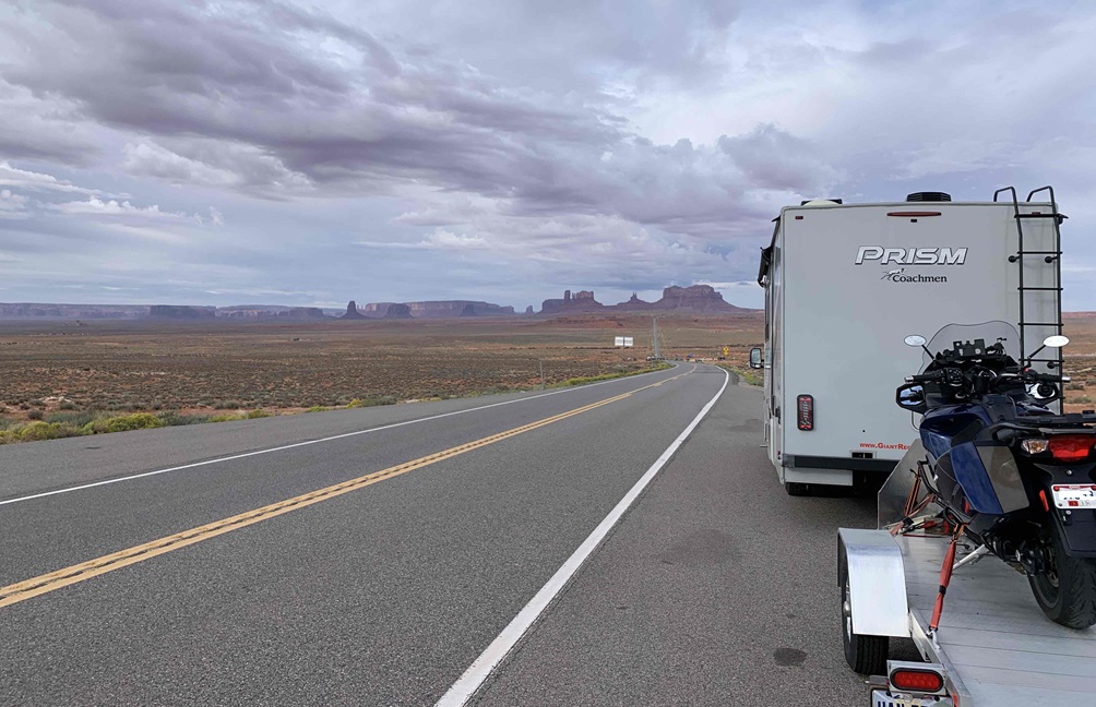 RV towing Jim's motorcycle toward Monument Valley during the 2023 Western Trip