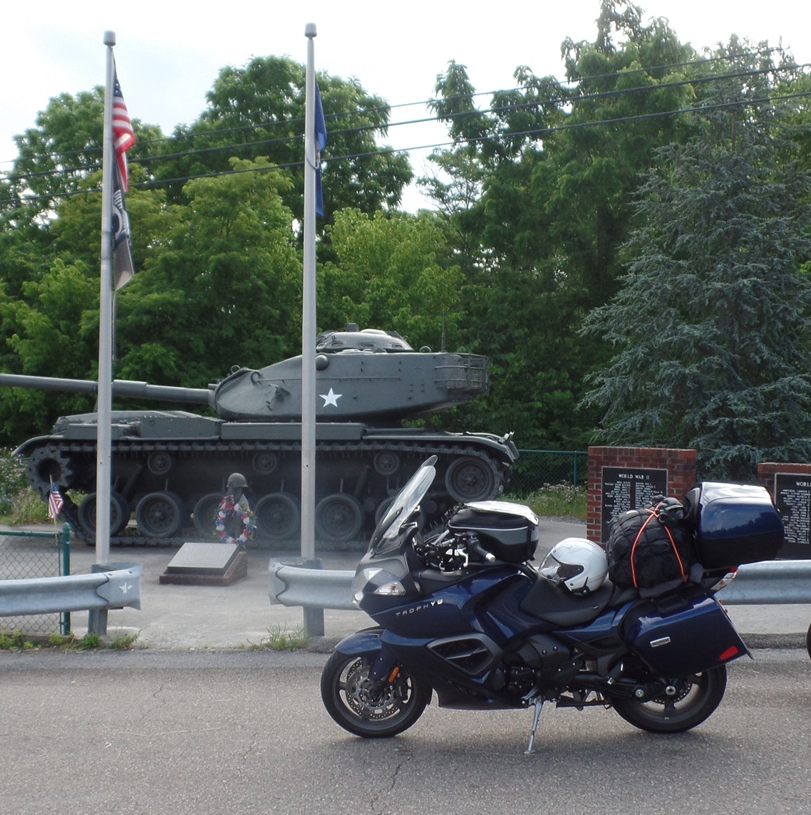 Jim's Triumph Trophy parked beside a scenic road